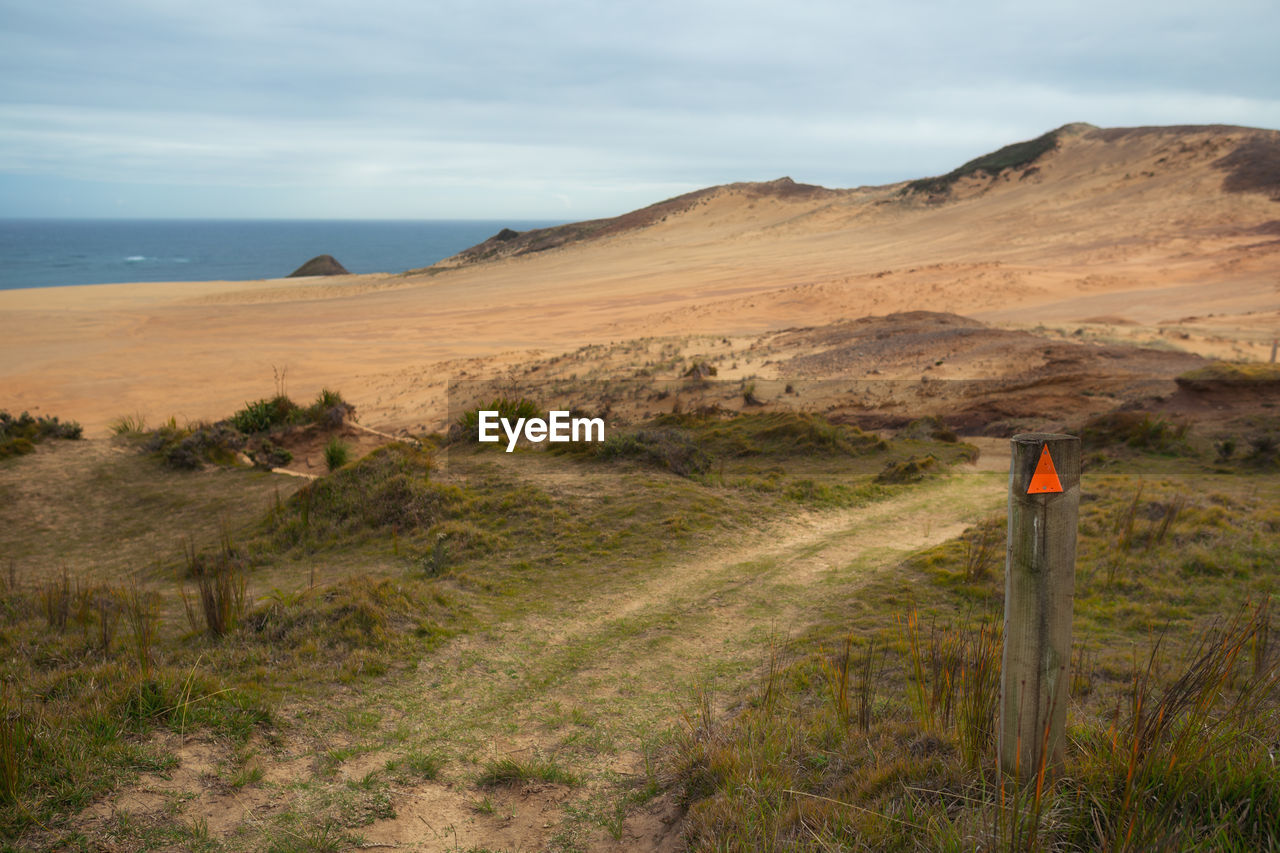 SCENIC VIEW OF SEA AND ROCKS AGAINST SKY