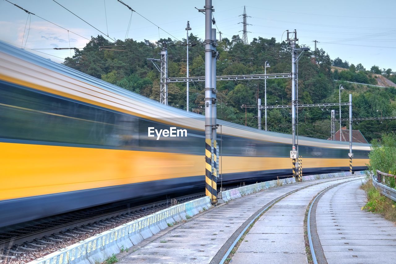 Blurred motion of train on railroad tracks