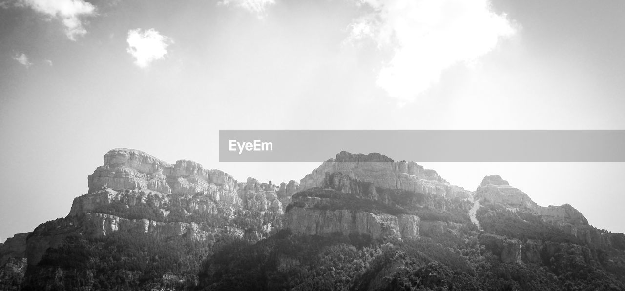 Scenic view of rocky mountains against sky