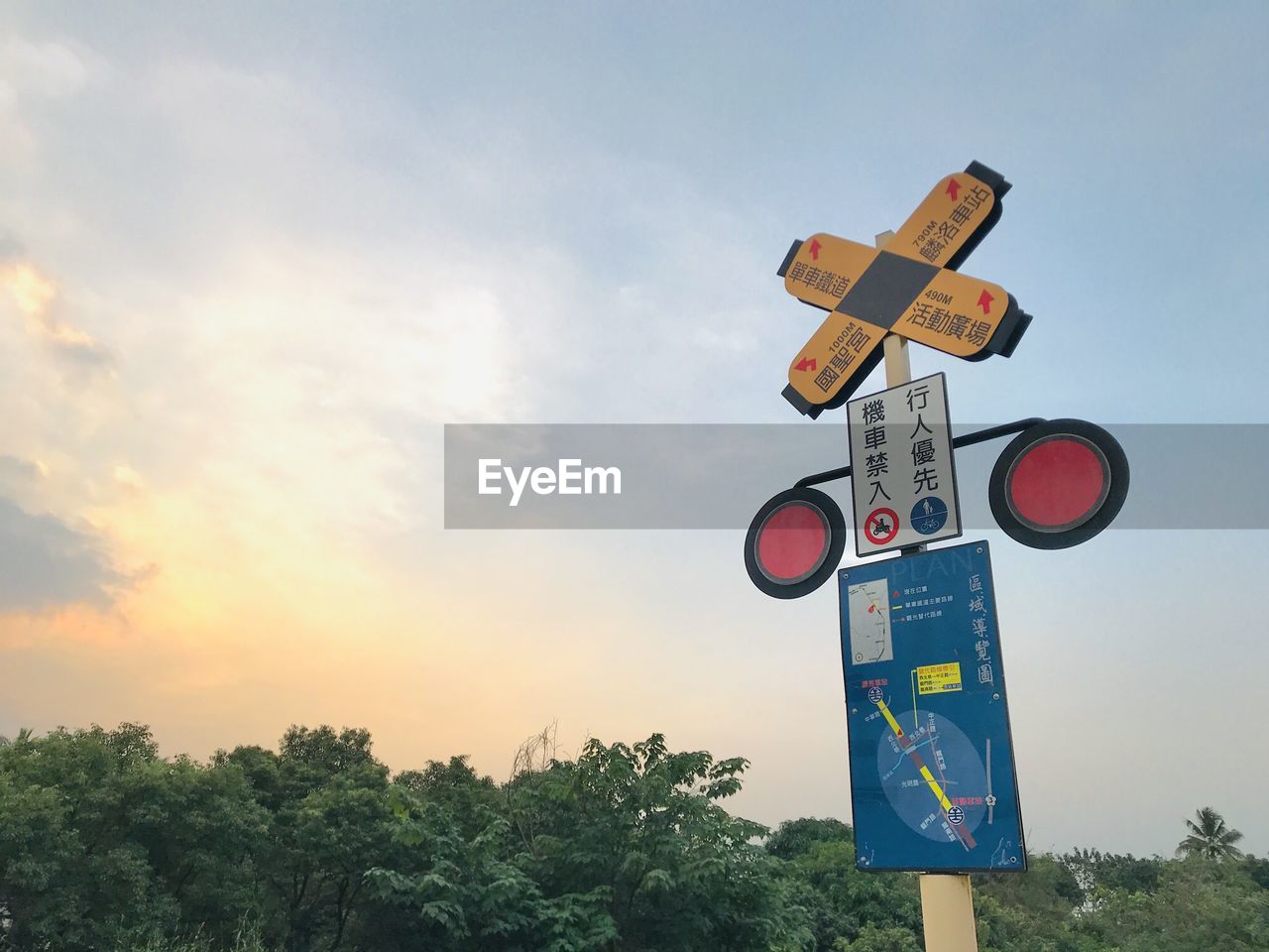 Low angle view of road sign against sky