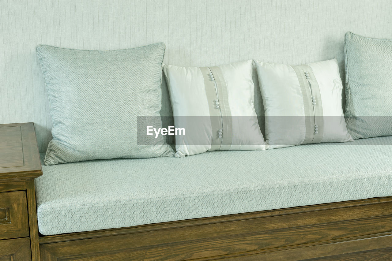 High angle view of cushions on sofa at home