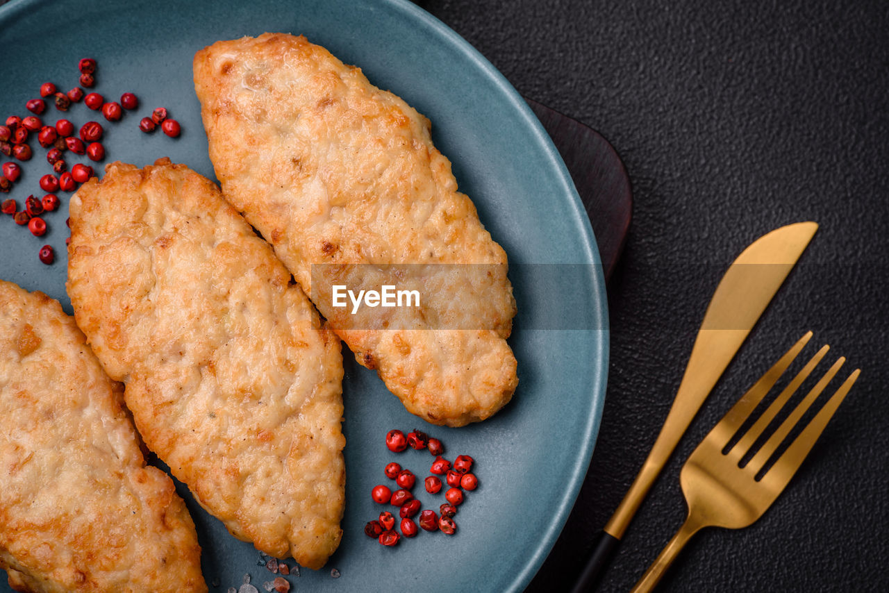 food, food and drink, dish, freshness, baked, produce, no people, kitchen utensil, indoors, studio shot, plate, fork, fried, high angle view, healthy eating, meal, eating utensil, fried food, meat, directly above, fruit, still life, breakfast, fast food, close-up, dessert, snack, cuisine