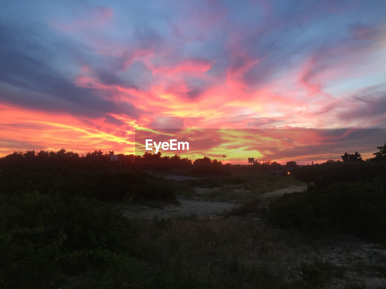 SCENIC VIEW OF DRAMATIC SKY OVER SILHOUETTE LANDSCAPE