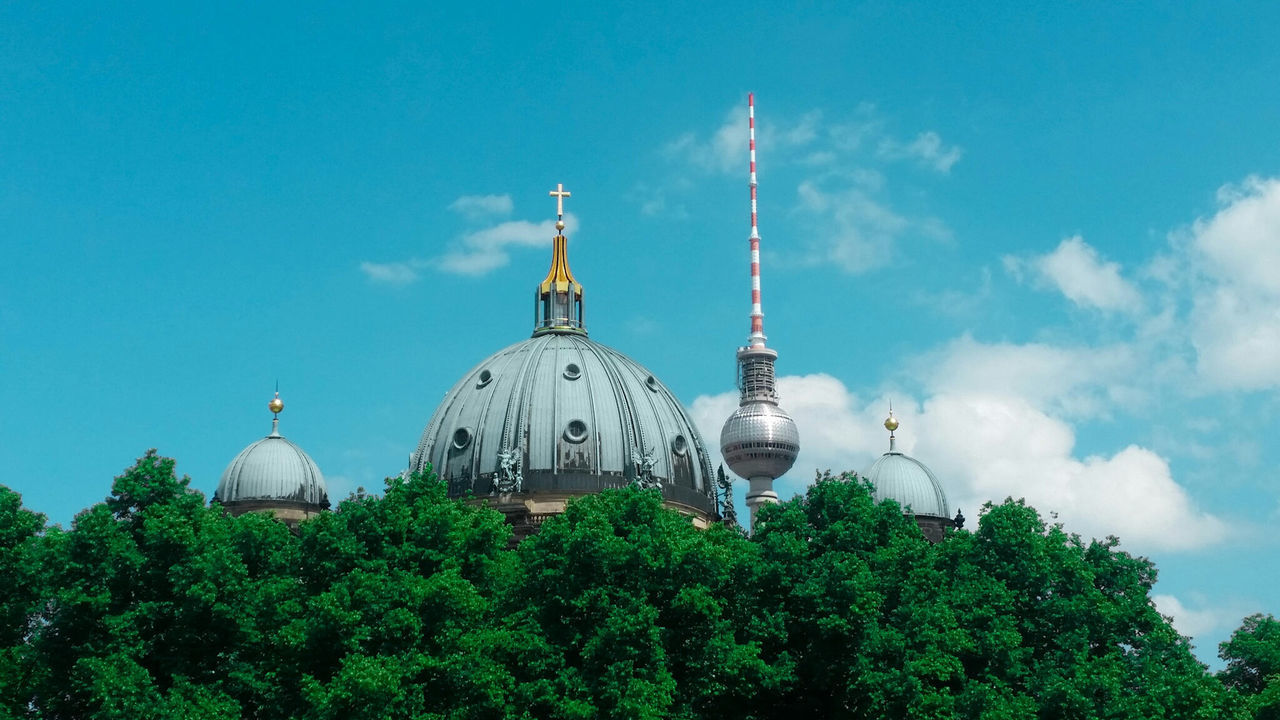 Low angle view of berlin cathedral and fernsehturm against sky