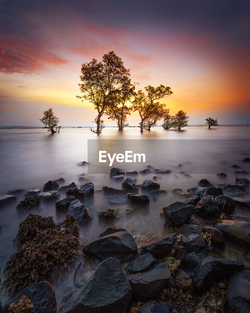 Scenic view of sea against sky at sunset