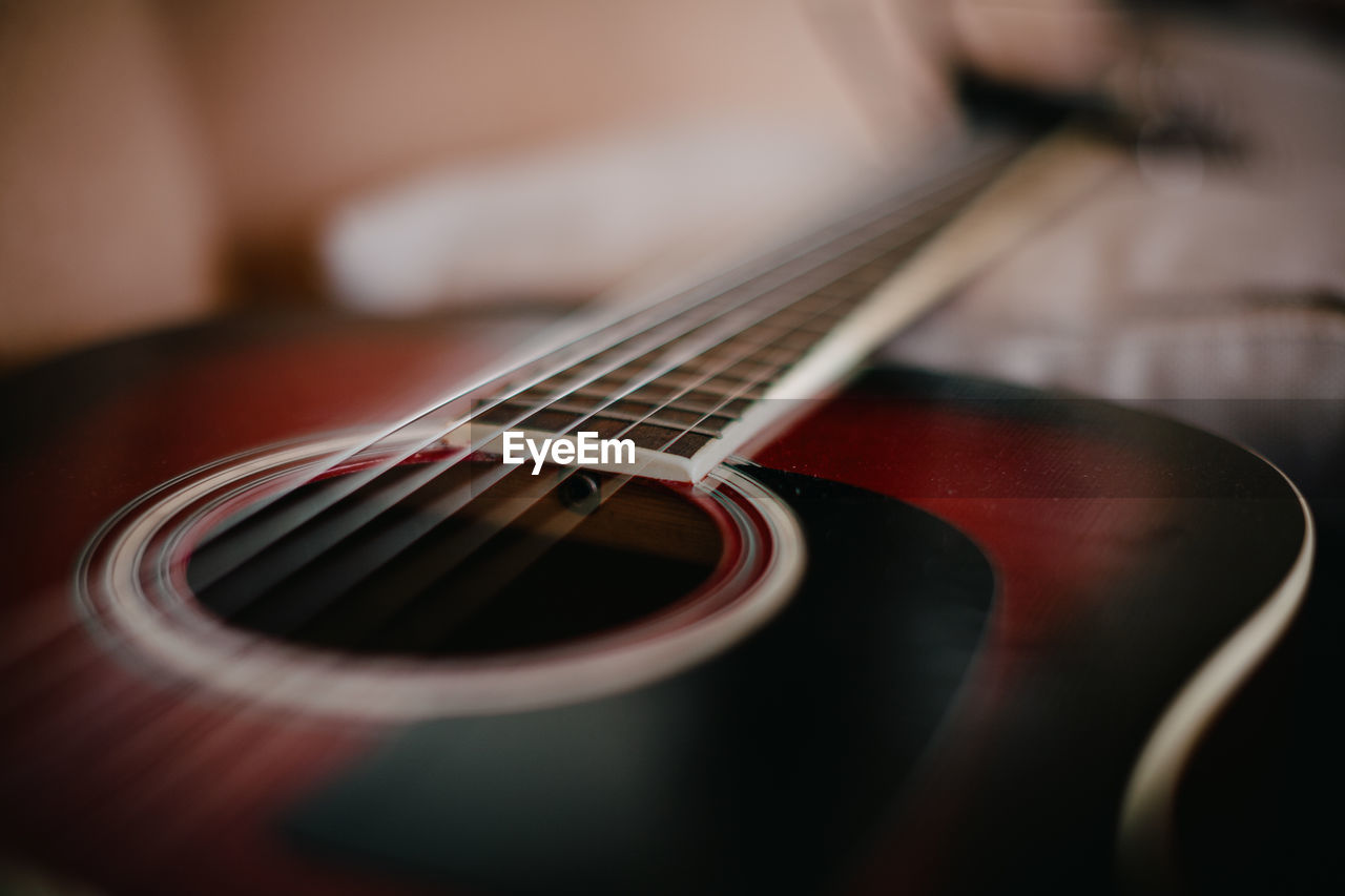 CLOSE-UP OF GUITAR IN BLURRED MOTION