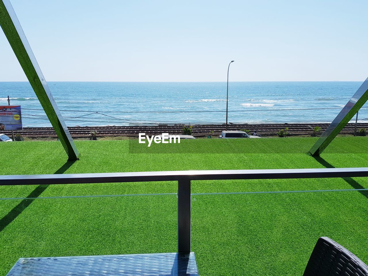 SCENIC VIEW OF SWIMMING POOL AGAINST SEA