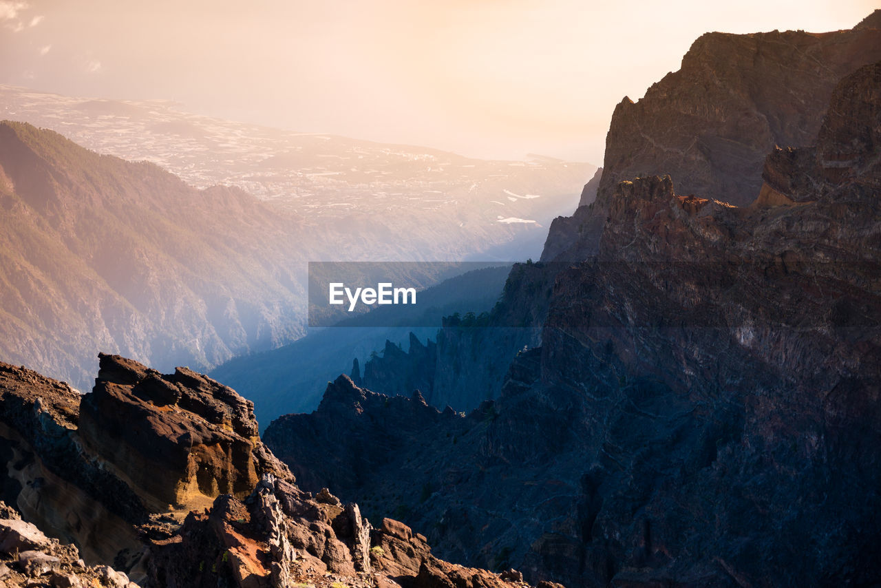 Scenic view of mountains against sky during sunset