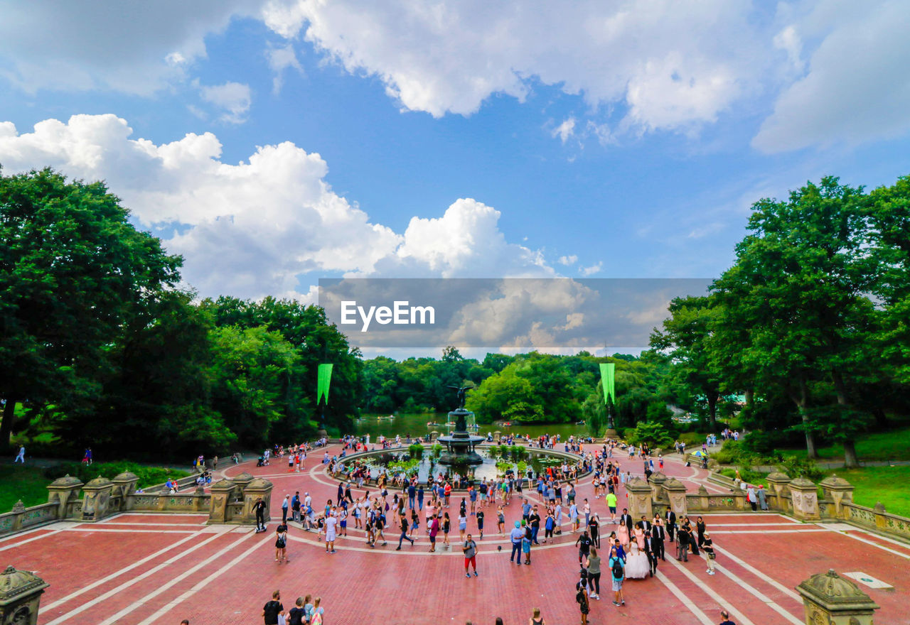 High angle view of people by plants against sky