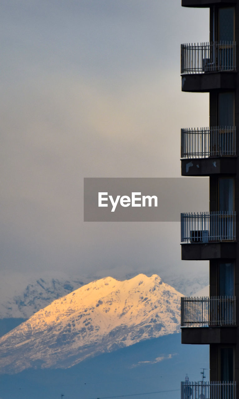 Low angle view of building against sky during sunset