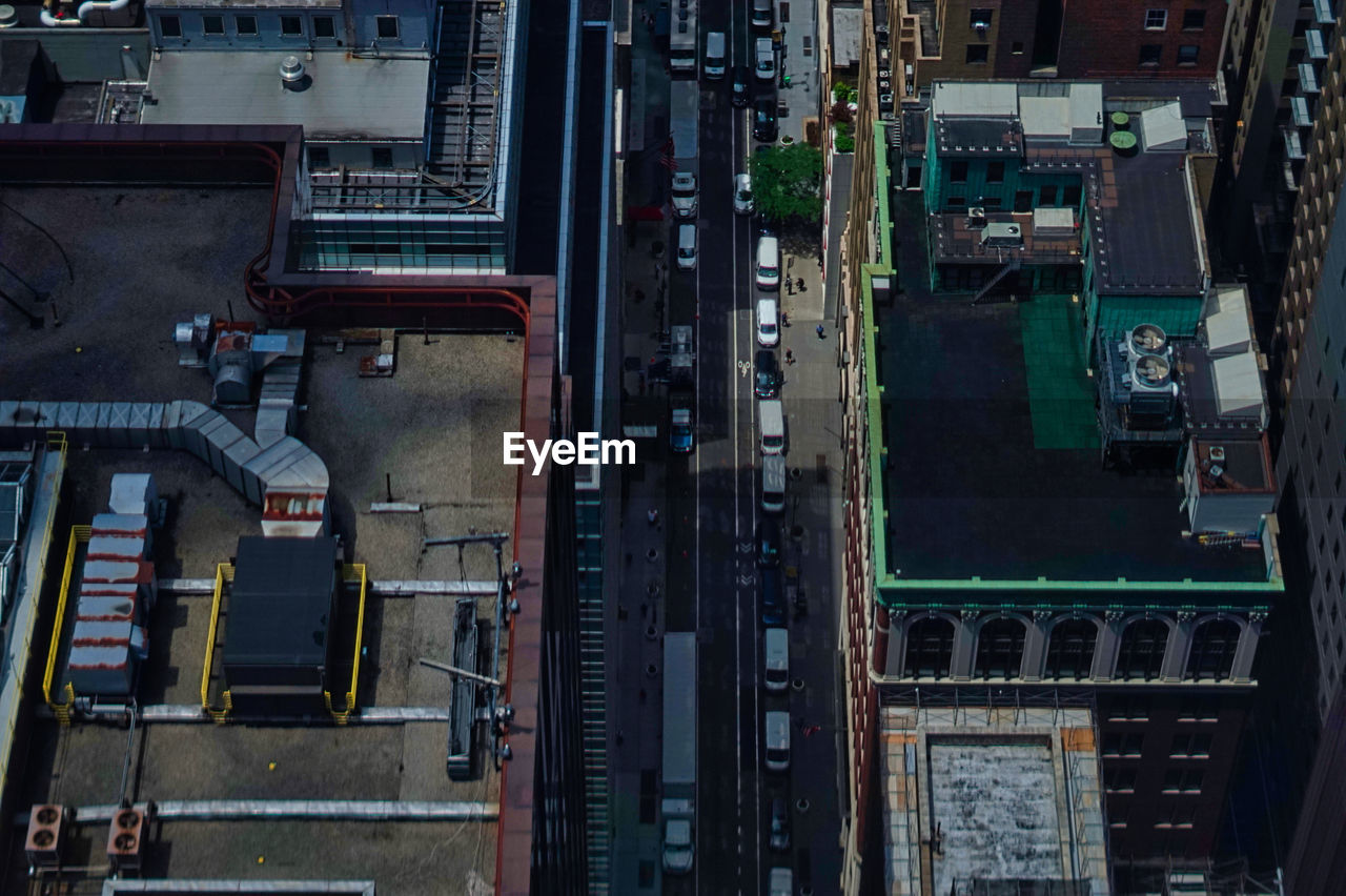 HIGH ANGLE VIEW OF RAILROAD TRACKS ALONG ROAD