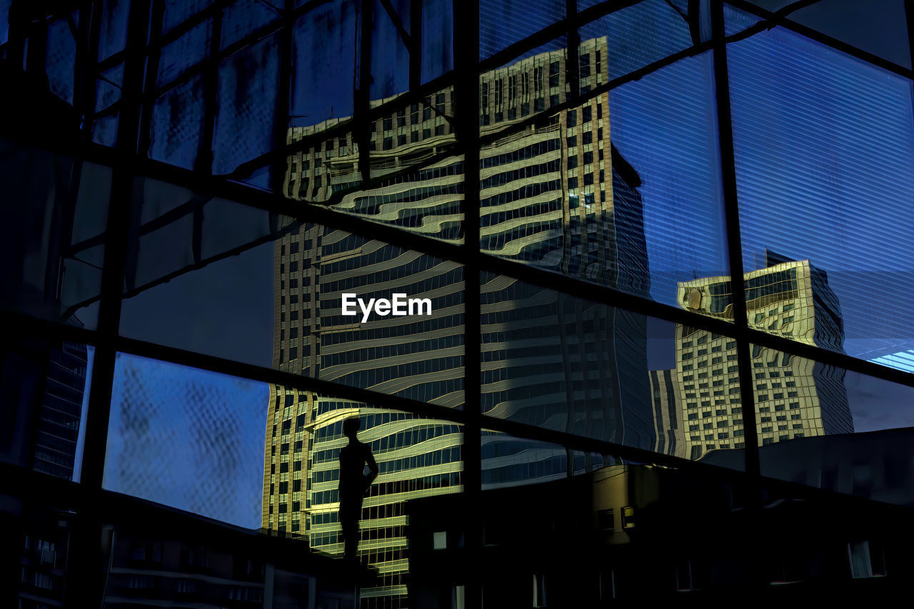 LOW ANGLE VIEW OF MODERN BUILDINGS AGAINST SKY