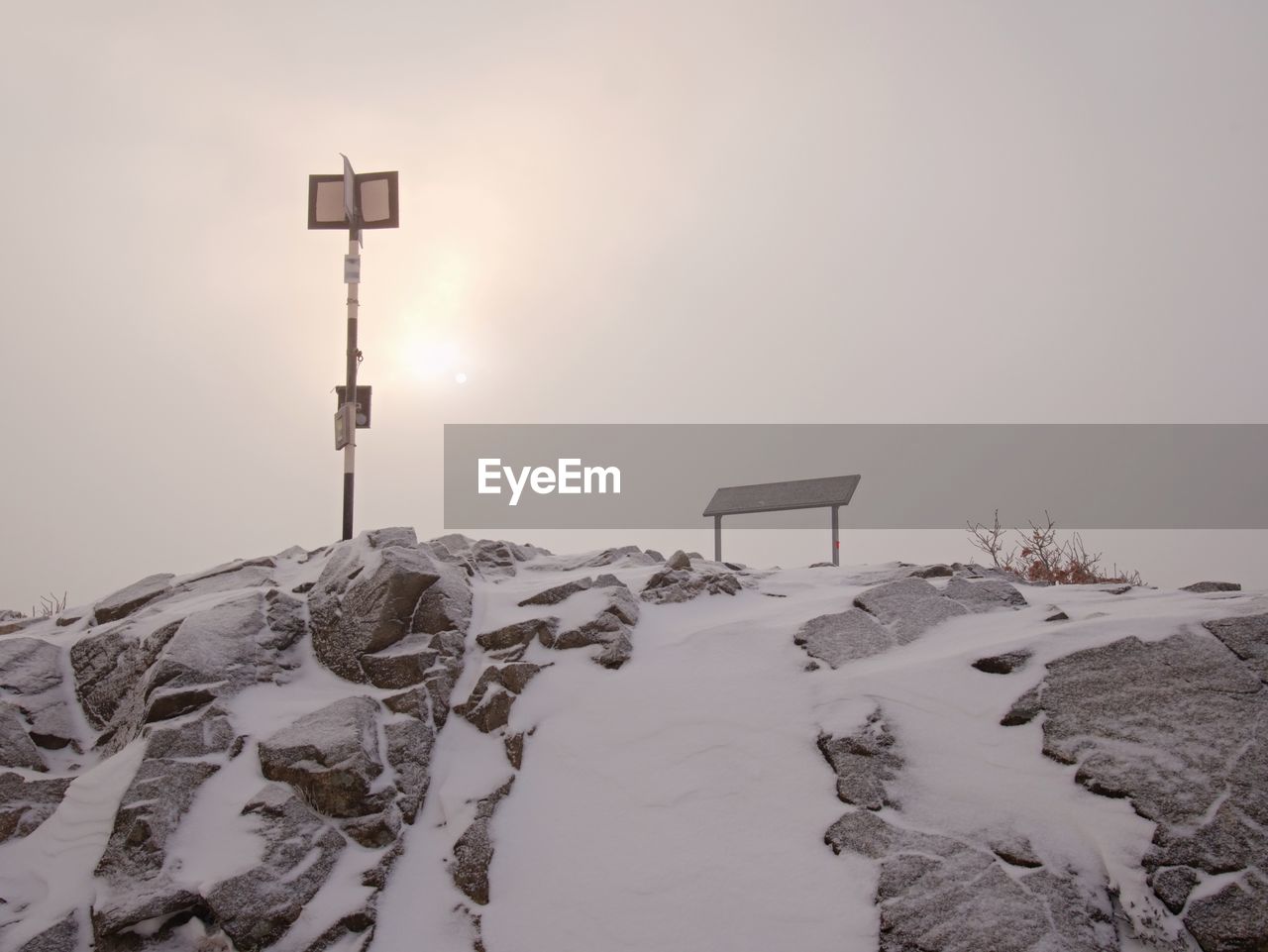 Slippery mountain tops in autumn covered with first snow and hidden in mist or cloud. danger weather