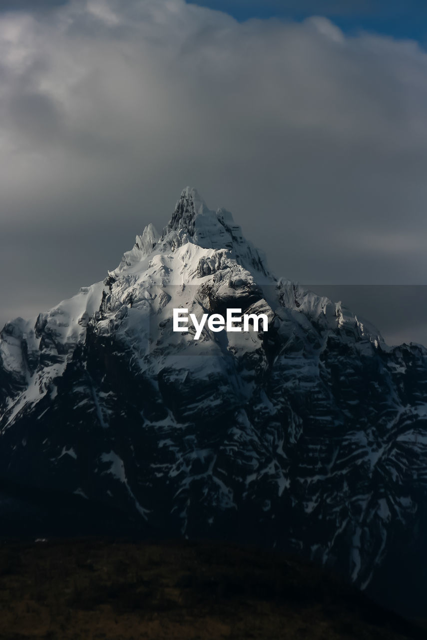 SNOW COVERED MOUNTAIN AGAINST SKY