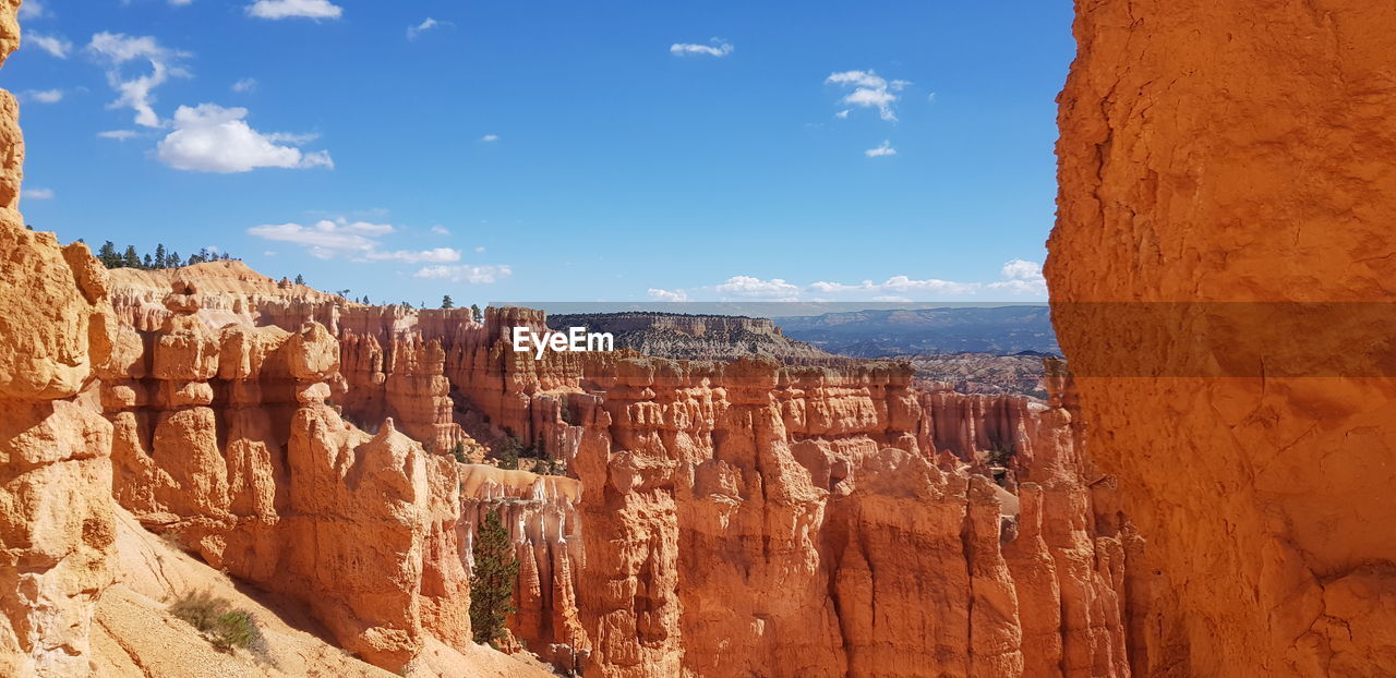 Panoramic view of rock formations against sky