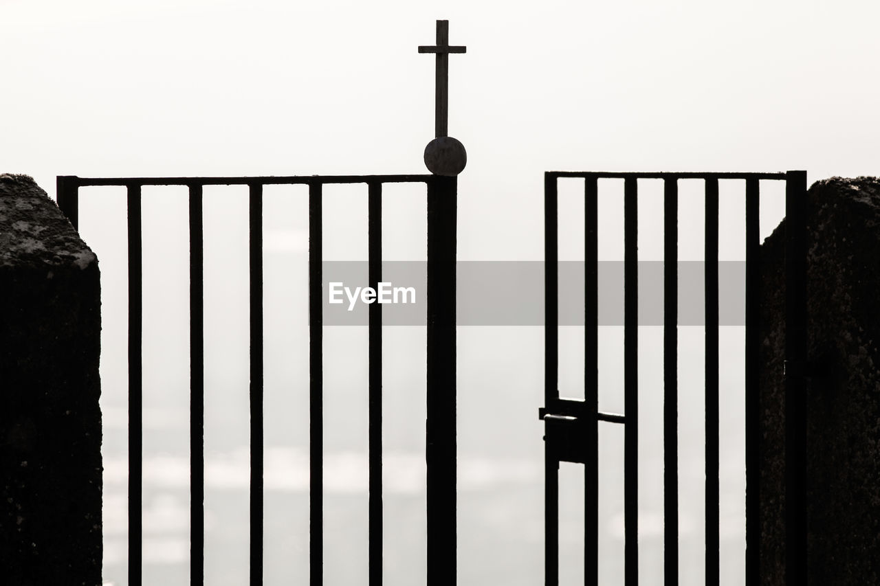 Close-up of metal railing against building