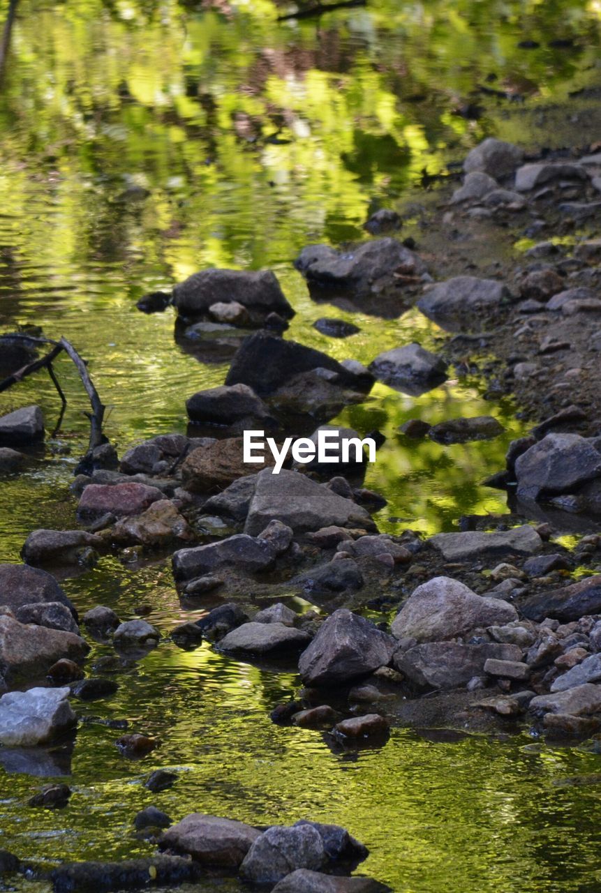 STREAM FLOWING THROUGH ROCKS