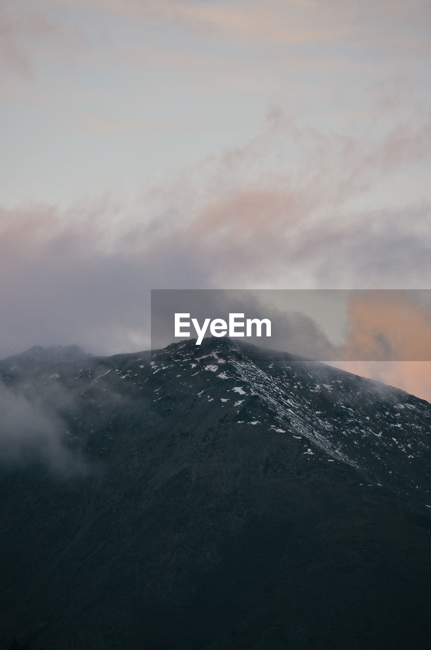 mountain, cloud, sky, environment, beauty in nature, scenics - nature, landscape, nature, no people, dawn, snow, volcano, fog, non-urban scene, smoke, horizon, land, outdoors, tranquility, mountain range, geology, cold temperature, tranquil scene, morning, travel, travel destinations, winter, sunlight, day, mountain peak, physical geography, mist, idyllic