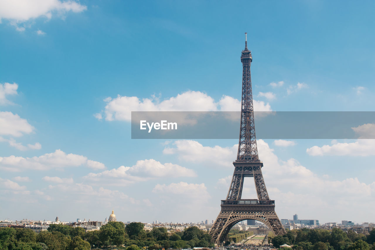 Eiffel tower against sky in city