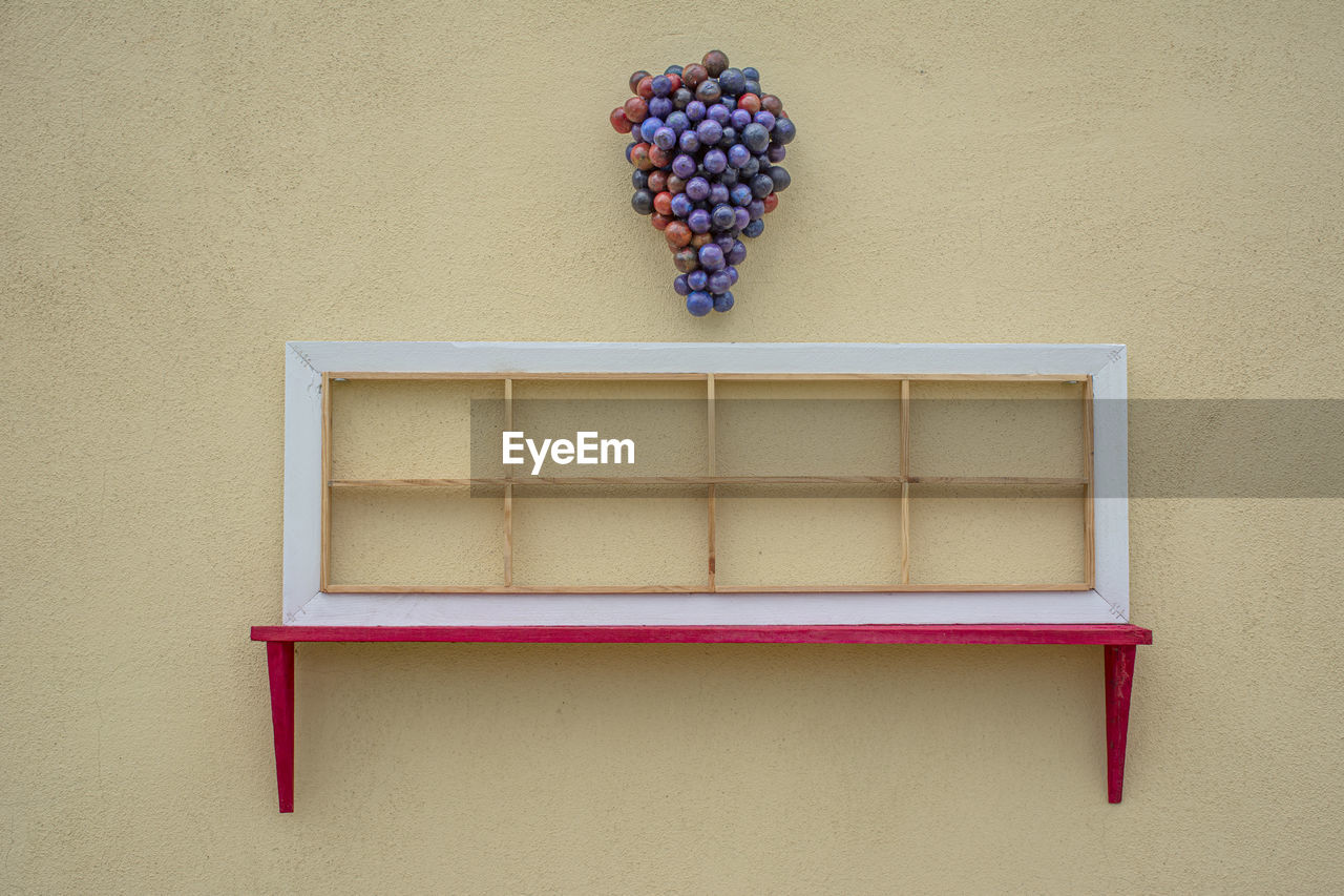 Directly above shot of fruits on table against wall