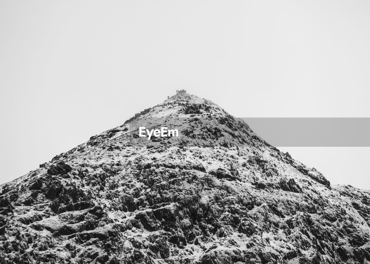 SCENIC VIEW OF MOUNTAINS AGAINST CLEAR SKY
