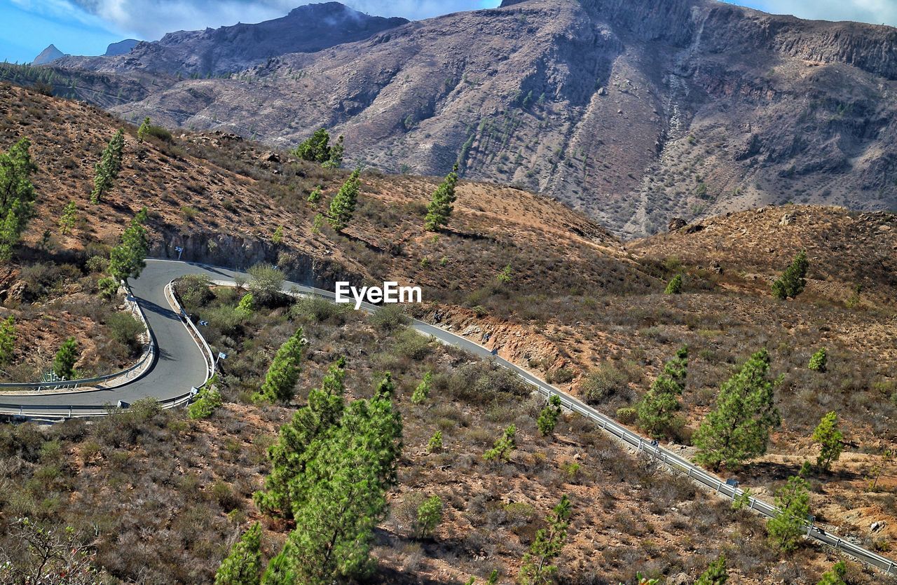 High angle view of road amidst mountains against sky