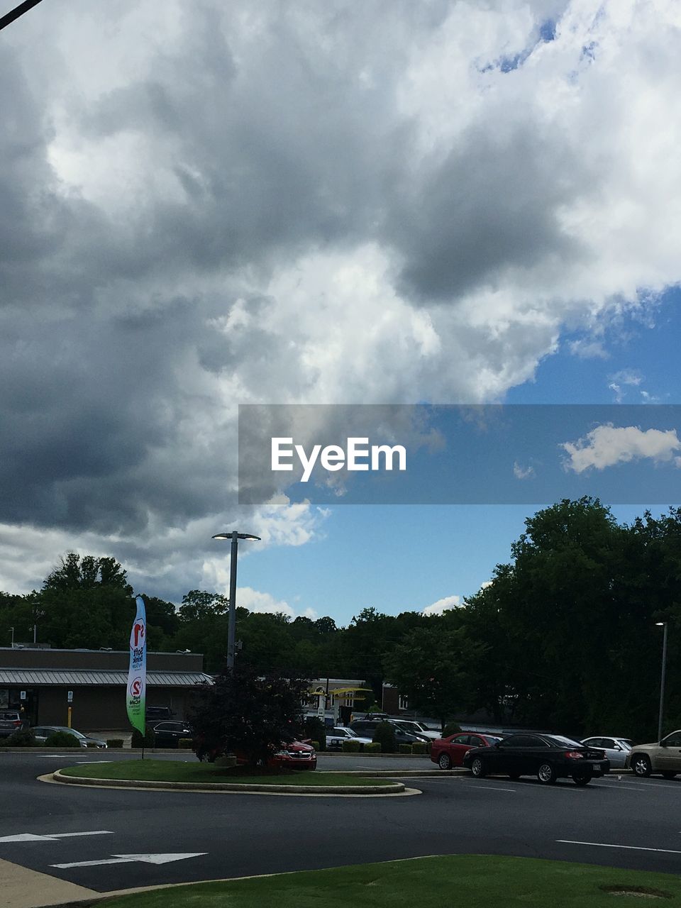 CARS ON ROAD AGAINST SKY