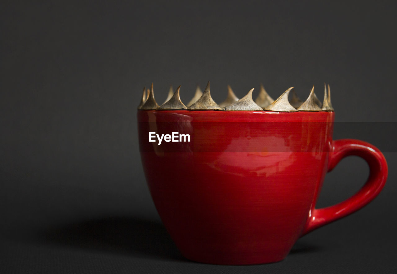 CLOSE-UP OF COFFEE CUP ON TABLE