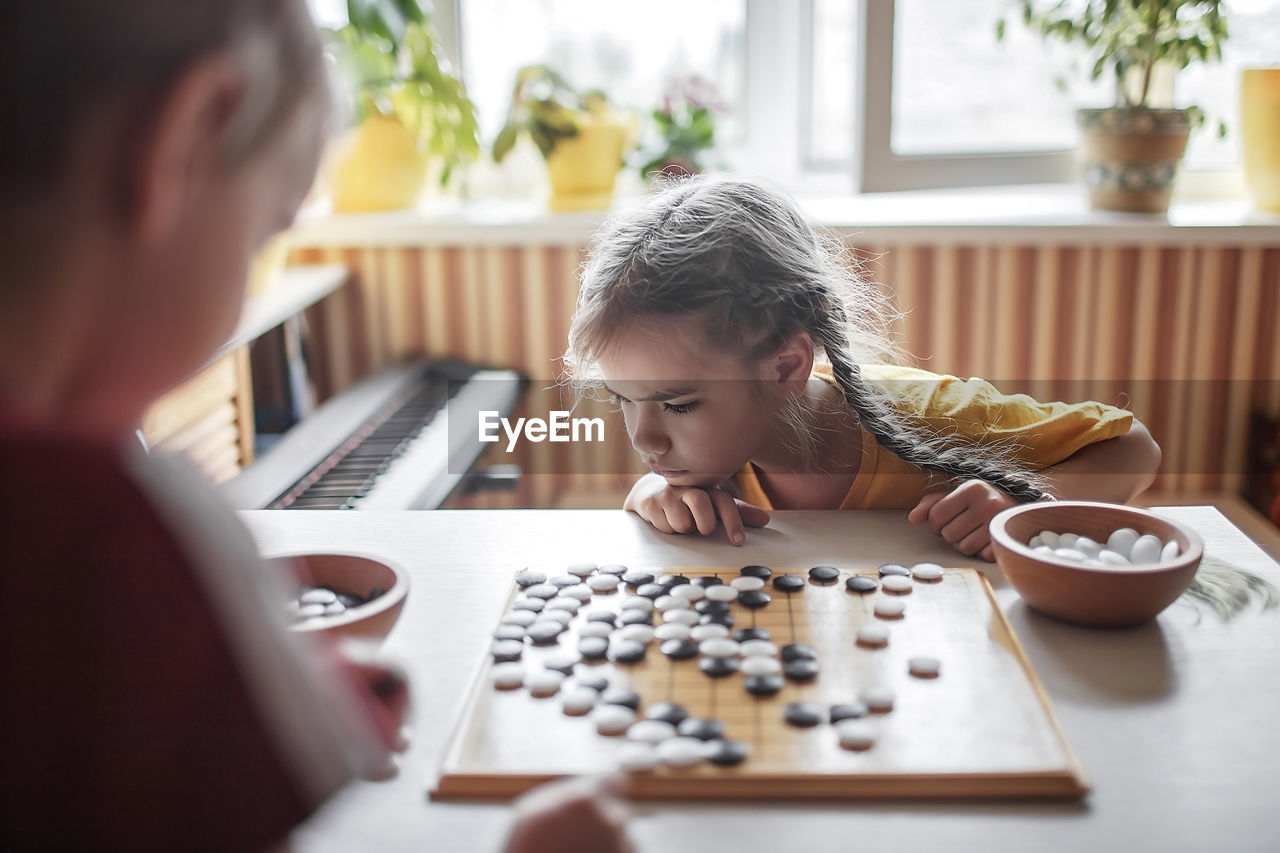 Boy playing on table