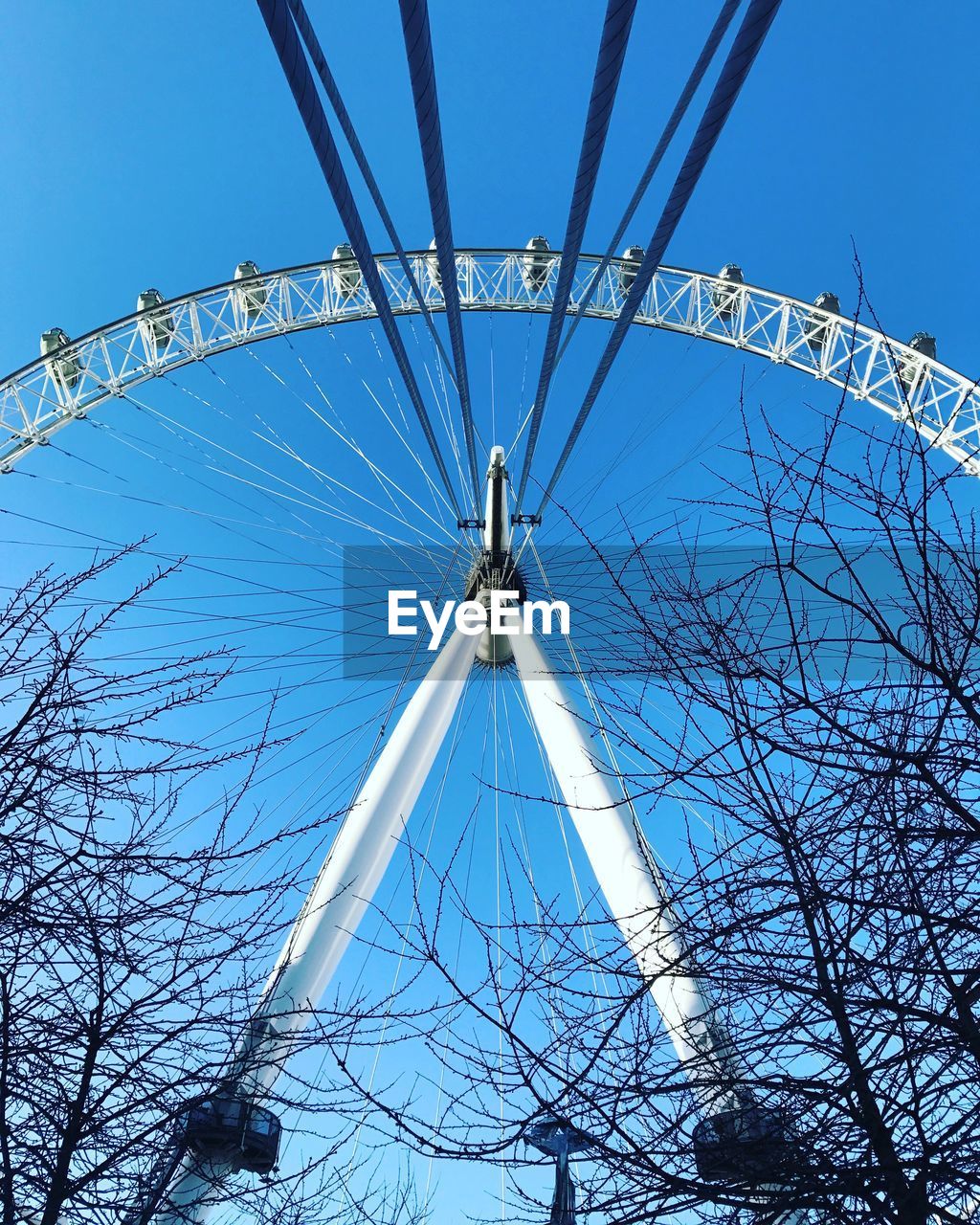 LOW ANGLE VIEW OF FERRIS WHEEL AGAINST SKY