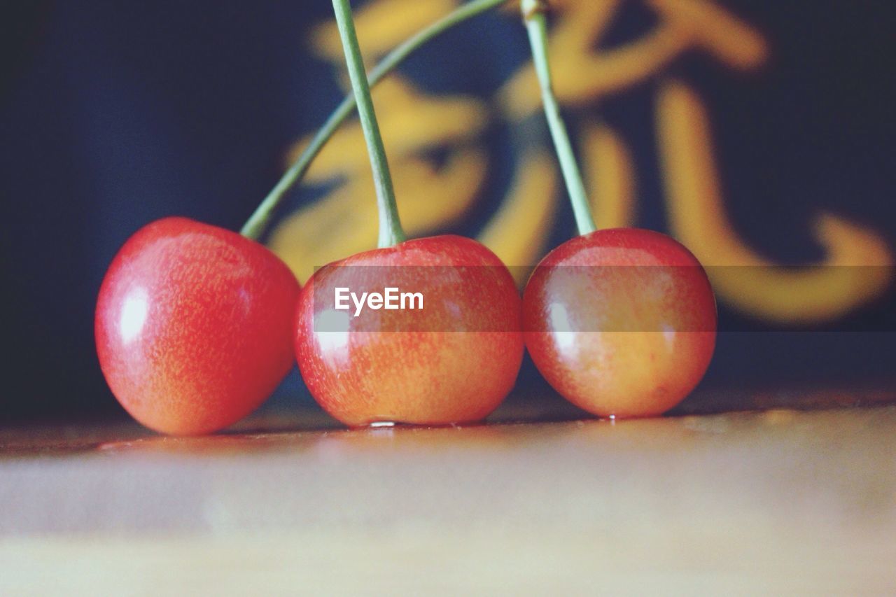 Close-up of cherries on table