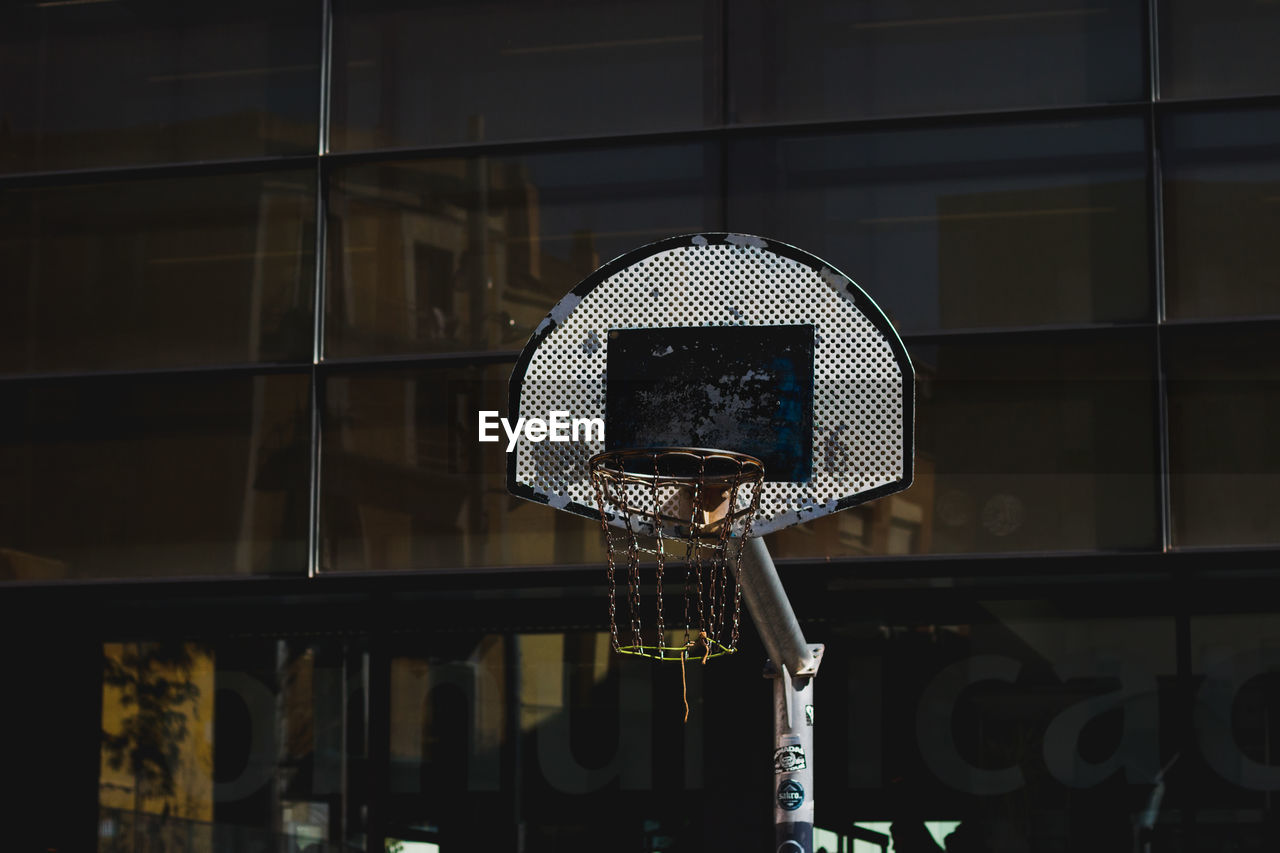 Basketball hoop against building