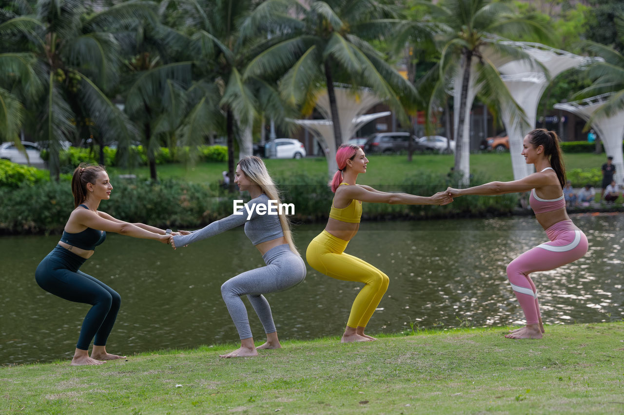 Four pretty young women doing fitness in the park instead of going to the gym. exercise