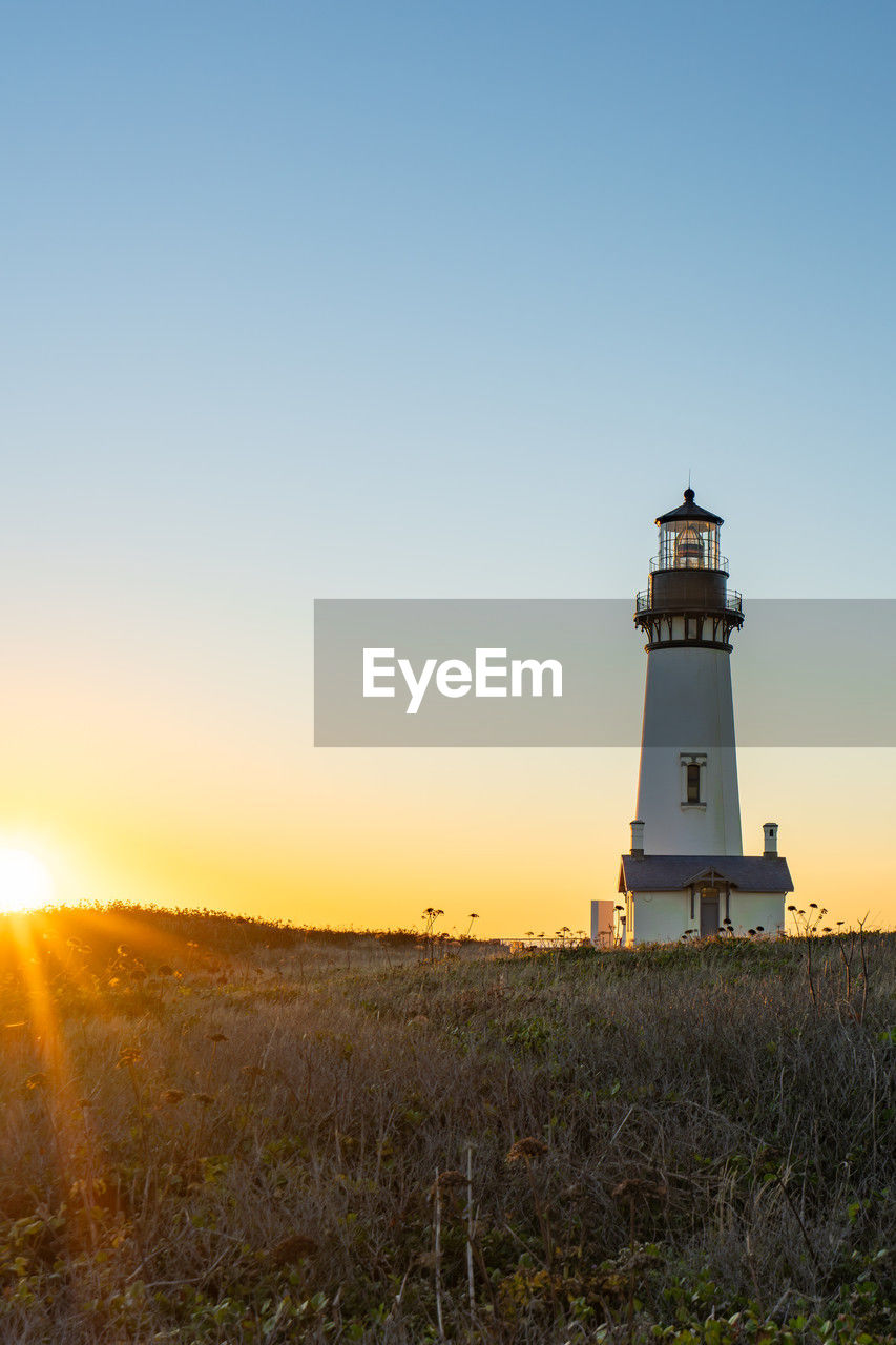 Sunset at yaquina head lighthouse, newport, oregon