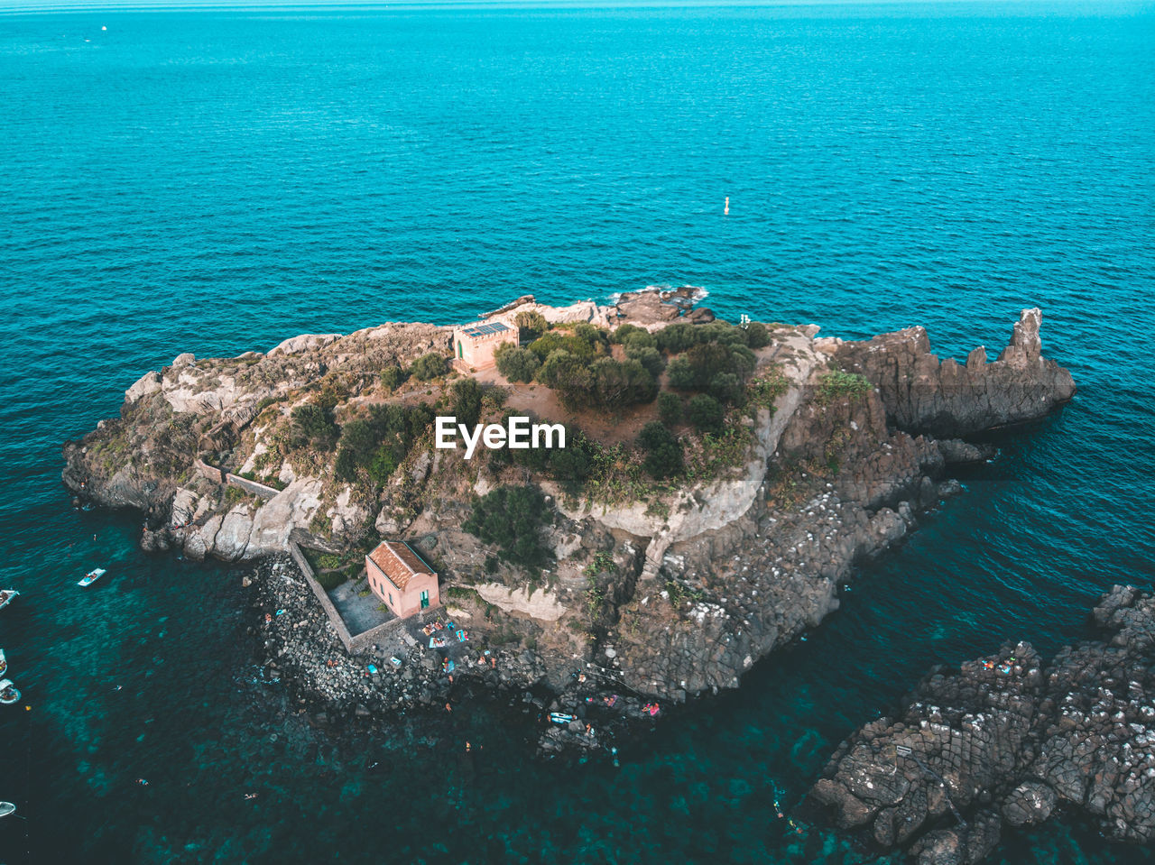 High angle view of rocks in sea