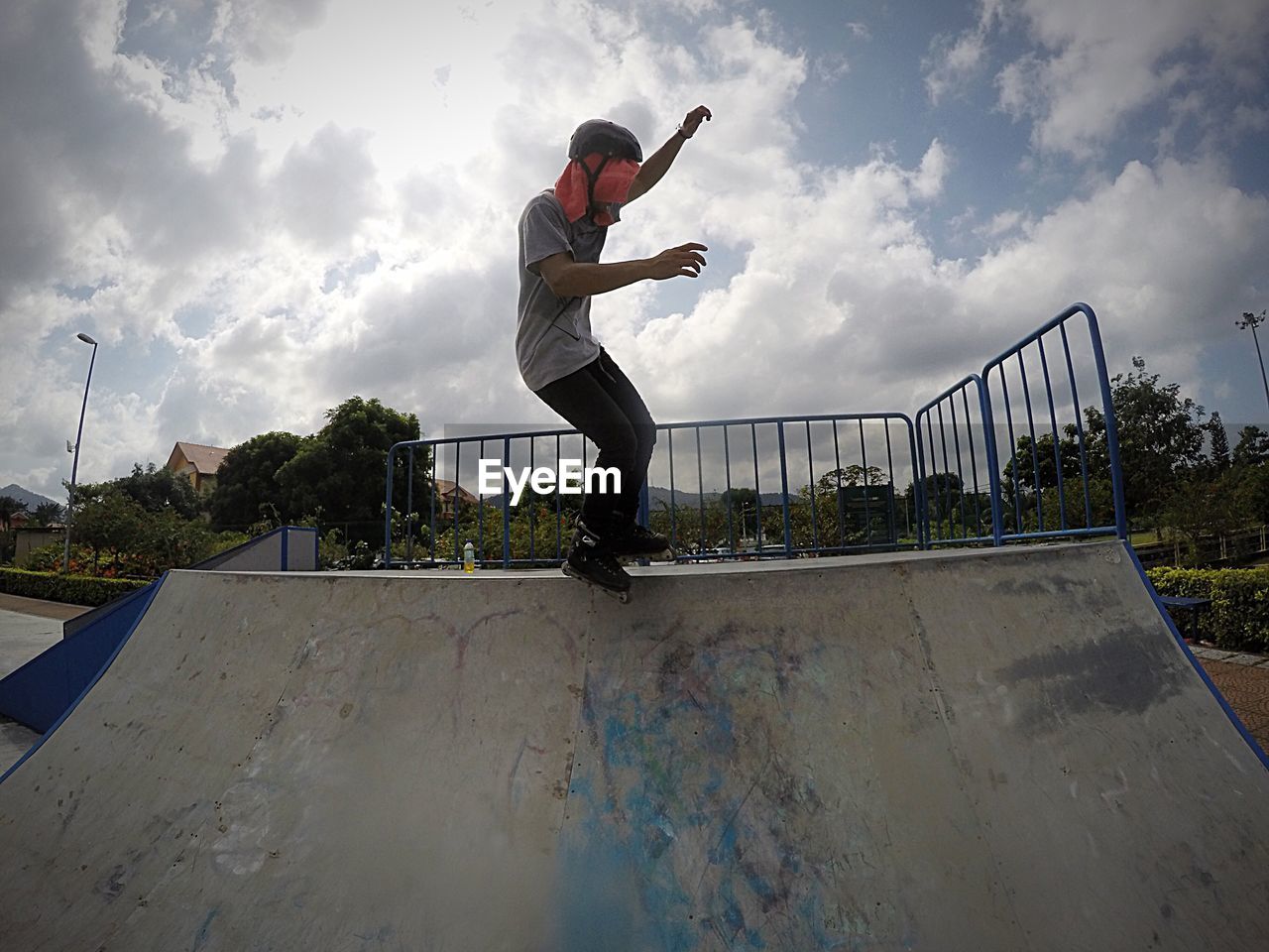 Full length of man inline skating on skateboarding ramp