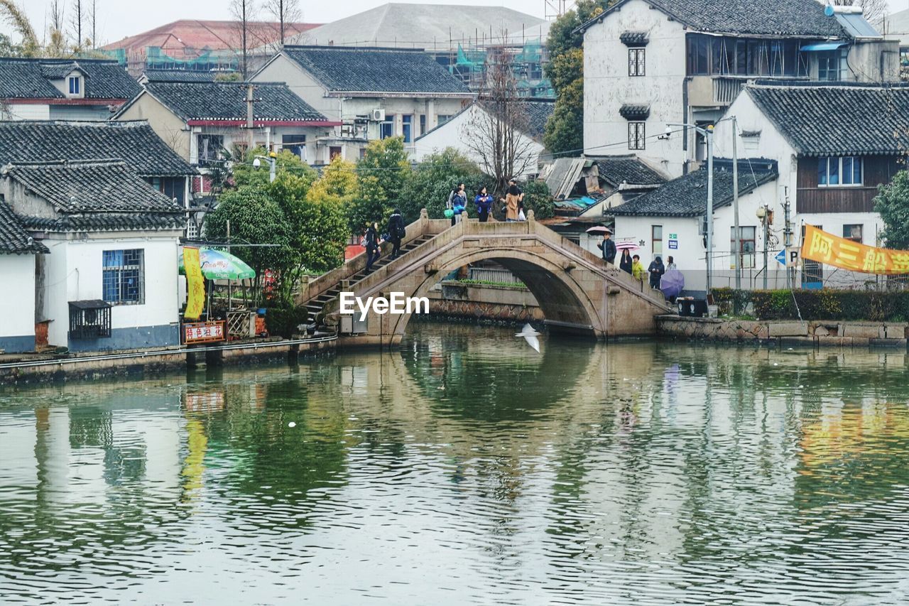 Footbridge over river in residential district