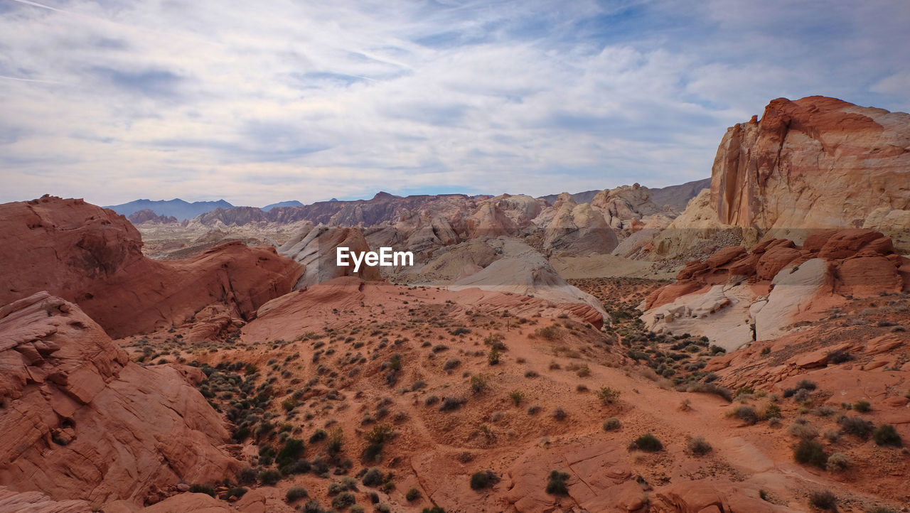 scenic view of rock formations against sky