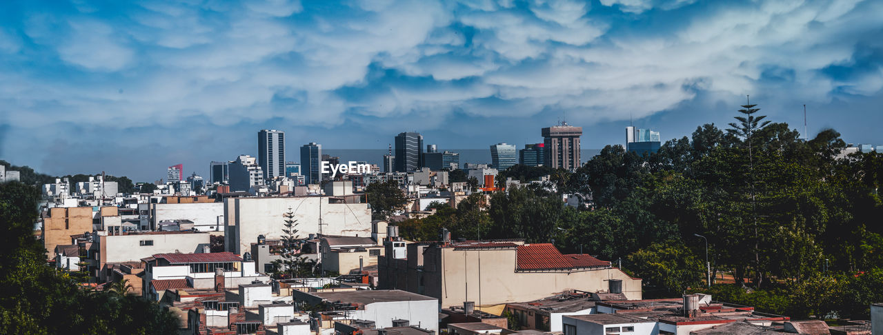 PANORAMIC SHOT OF BUILDINGS AGAINST SKY