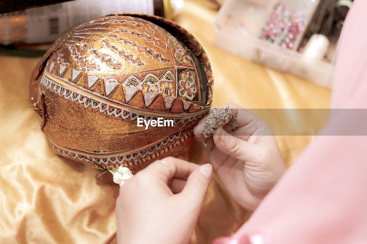 Close-up of woman holding jewelry