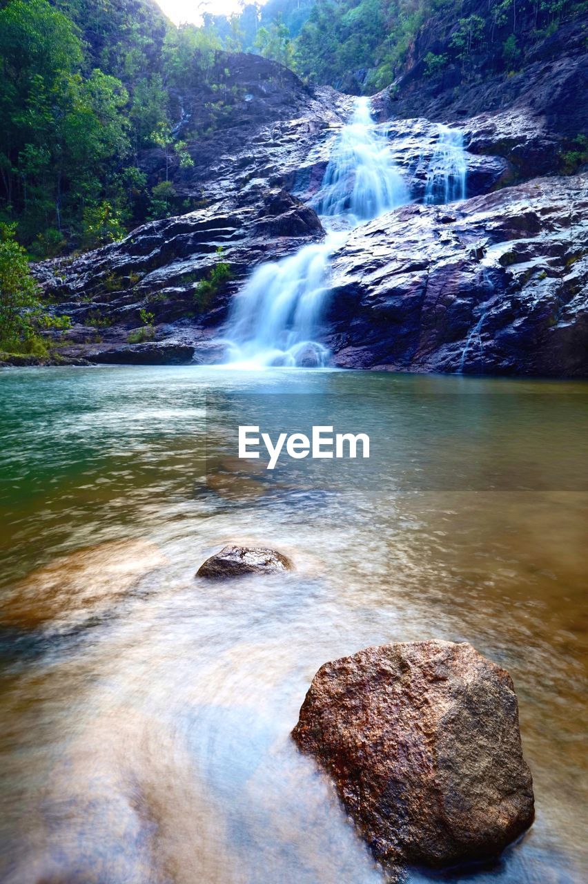 WATER FLOWING THROUGH ROCKS