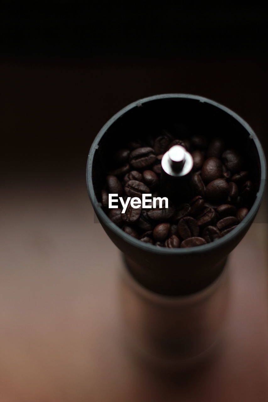 High angle view of coffee beans on grinder