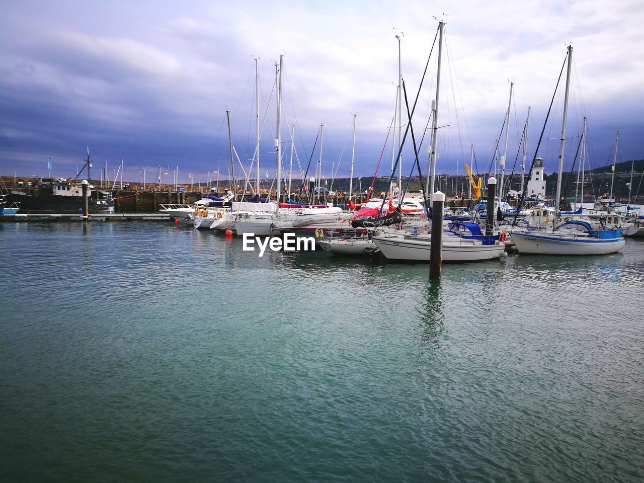 SAILBOATS MOORED IN MARINA