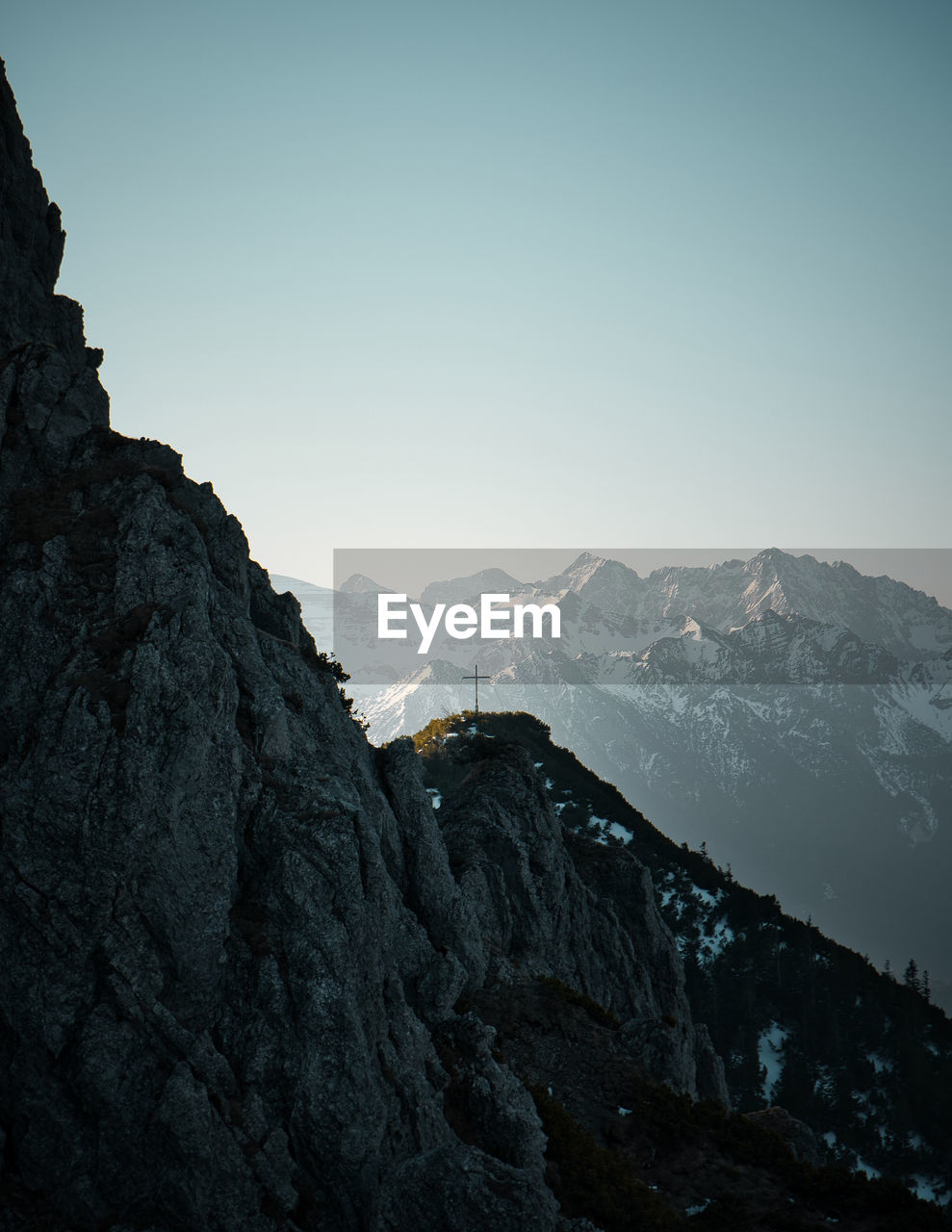 Scenic view of snowcapped mountains against clear sky