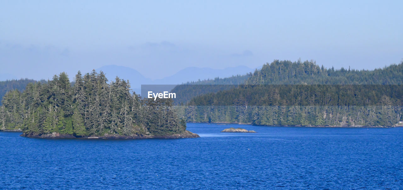 Scenic view of ocean inlets and mountain range