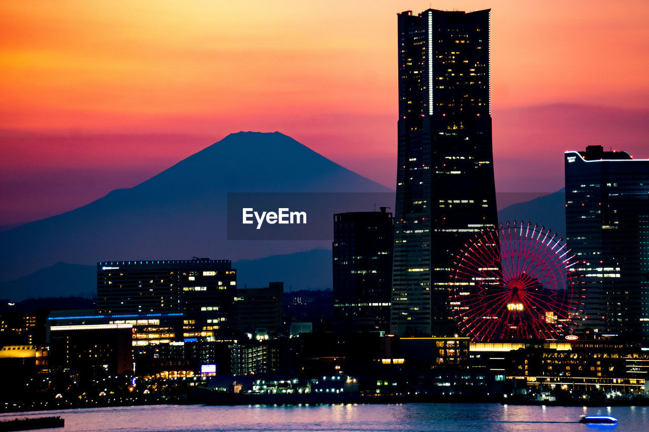 Illuminated buildings in city at night　and  mountain fuji