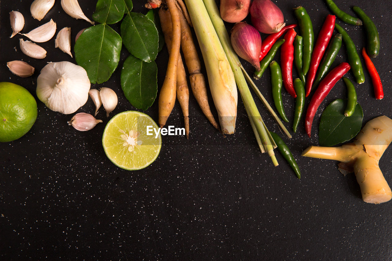 Close-up of various vegetables over black background