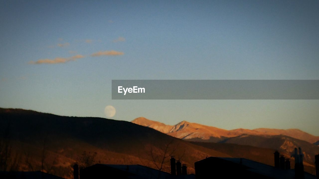 SCENIC VIEW OF LANDSCAPE AGAINST SKY DURING SUNSET