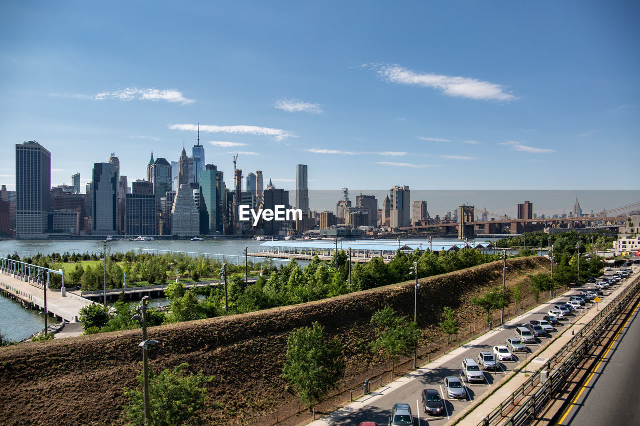 PANORAMIC SHOT OF MODERN BUILDINGS AGAINST SKY