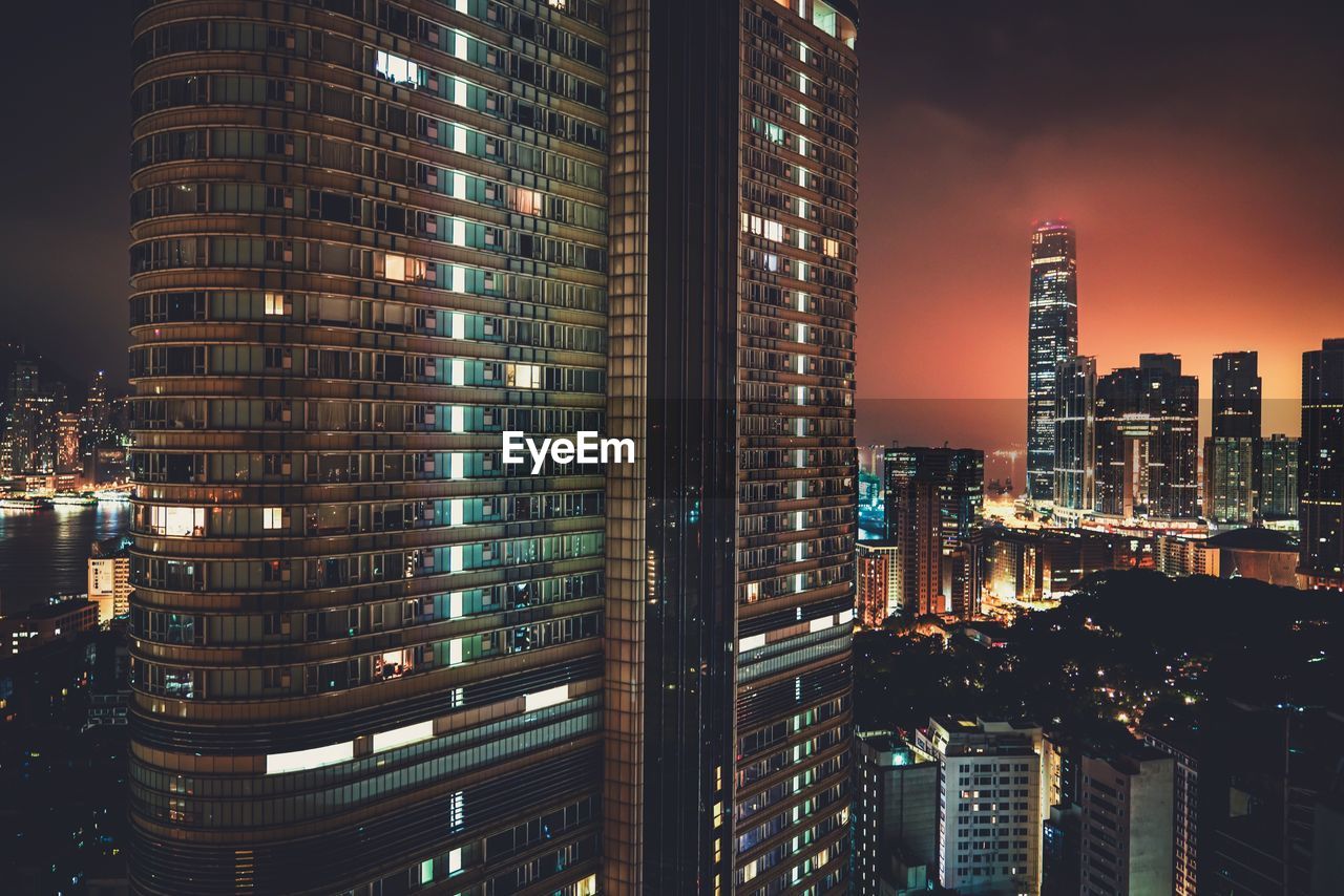 Illuminated modern buildings in city at night